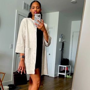 Lamb colored soft shell coat.